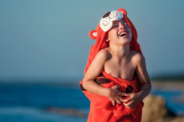 Cute little boy wearing tiger towel outdoors — Stock Photo, Image