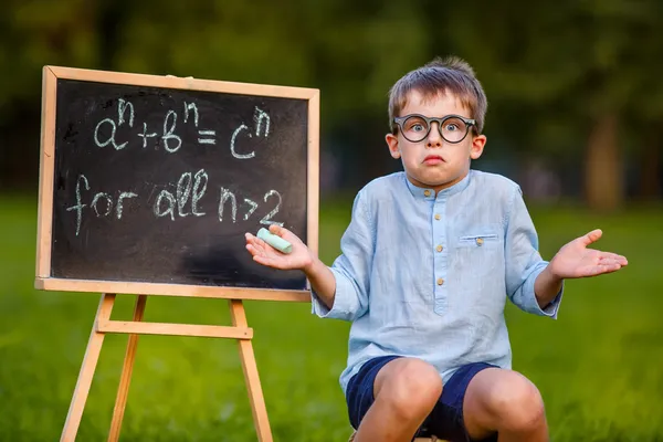 Cute little confused student — Stock Photo, Image