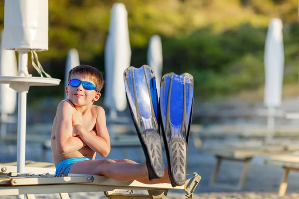 Boy with snorkeling equipment at tropical beach — Stock Photo, Image