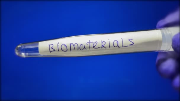 Test Tube Taking Biomaterials Doctor Hand Medical Glove Blue Background — Wideo stockowe