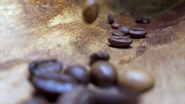 Selective Focus Arabica Coffee Beans Falling Natural Wooden Background Slow — Vídeo de stock