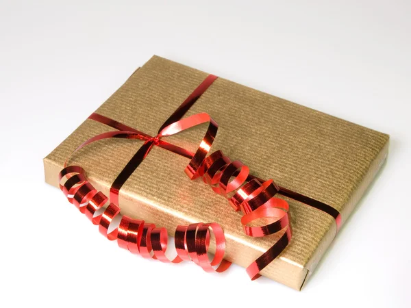Gift in gold and red — Stock Photo, Image