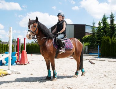 Girl practising horse riding clipart