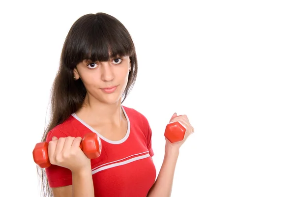 Attractive young woman doing exercises with dumbbells. — Stock Photo, Image