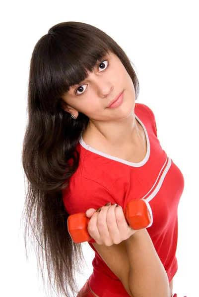 Attractive young girl doing exercises with dumbbells. — Stock Photo, Image