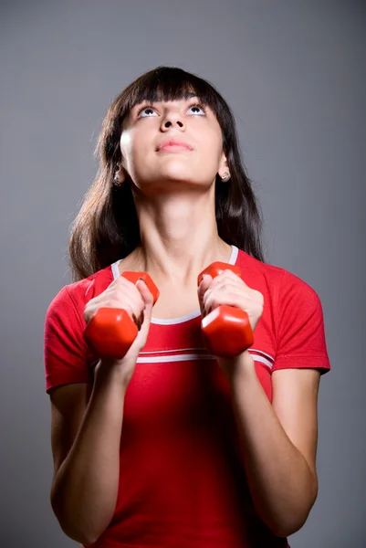 Young lady doing workout with dumbbells — Stock Photo, Image