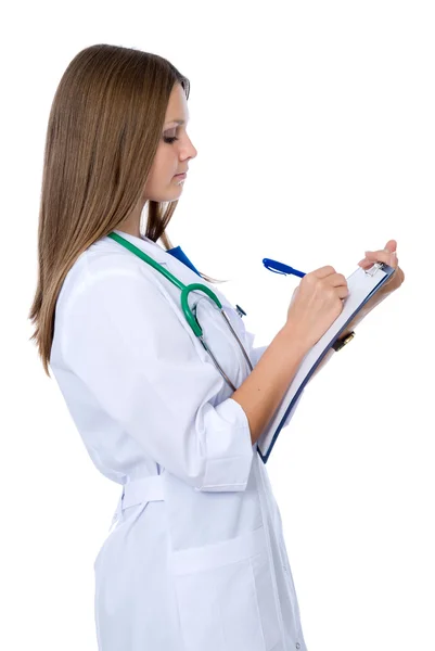Female doctor taking notes Royalty Free Stock Images