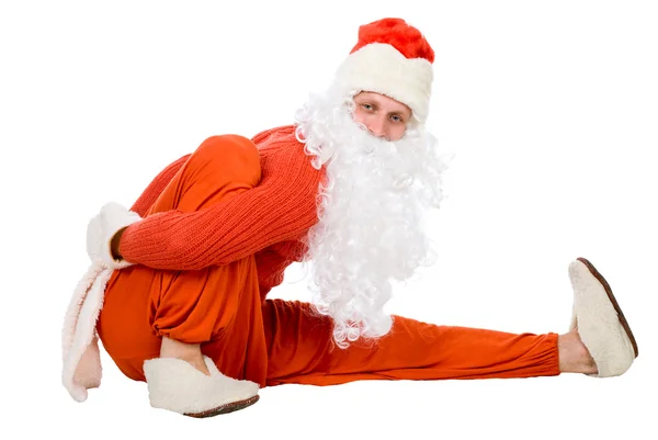 Santa Claus does gymnastics — Stock Photo, Image