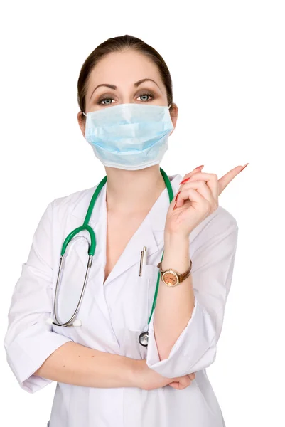 Portrait of a woman doctor in a mask with a raised finger — Stock Photo, Image