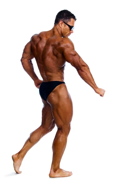 Bodybuilder showing his muscles — Stock Photo, Image