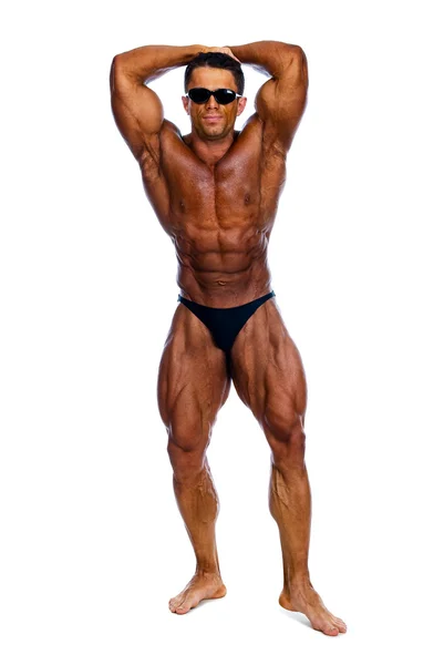 Muskulös männlich modell posiert im studio — Stockfoto