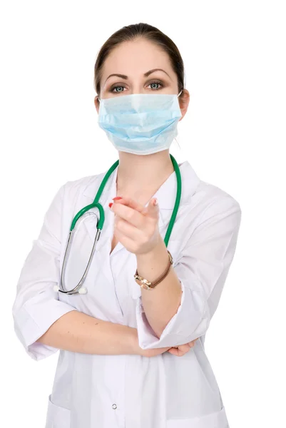 Portrait of a woman doctor in a mask with a raised finger — Stock Photo, Image