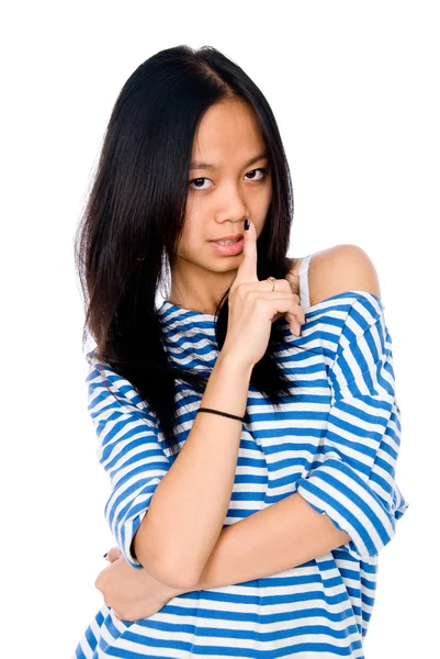 Beautiful woman with her finger to her lips — Stock Photo, Image