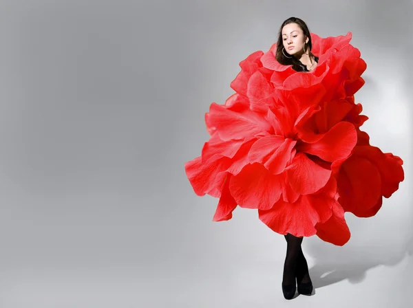 Beautiful young girl wearing red rose dress — Stock Fotó