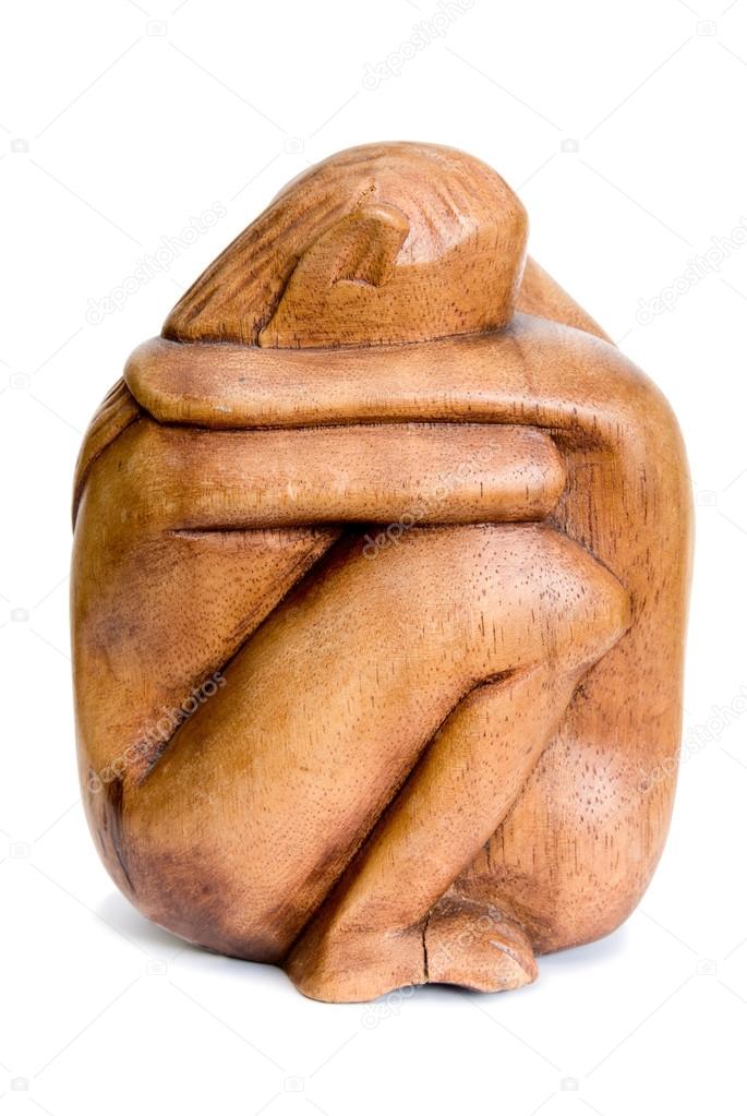 Wooden figurines to hug couple. Front view.