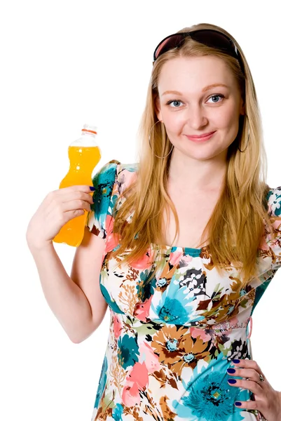 A girl with a bottle of orange juice. — Stock Photo, Image