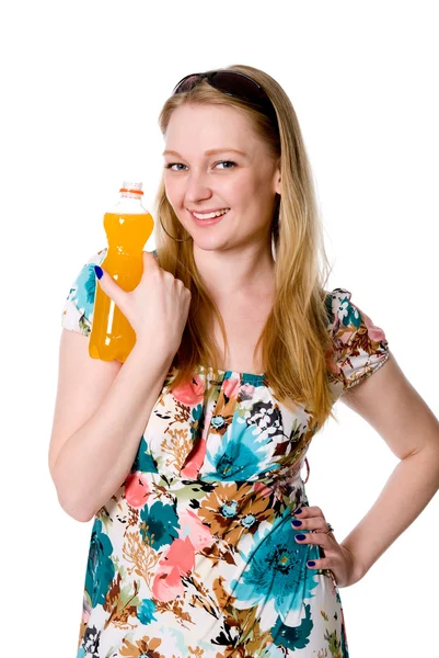 A girl with a bottle of orange juice — Stock Photo, Image