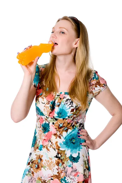 Portrait of young woman drinking juice — Stock Photo, Image