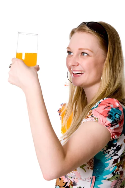Happy healthy girl with a glass of orange drink — Stock Photo, Image