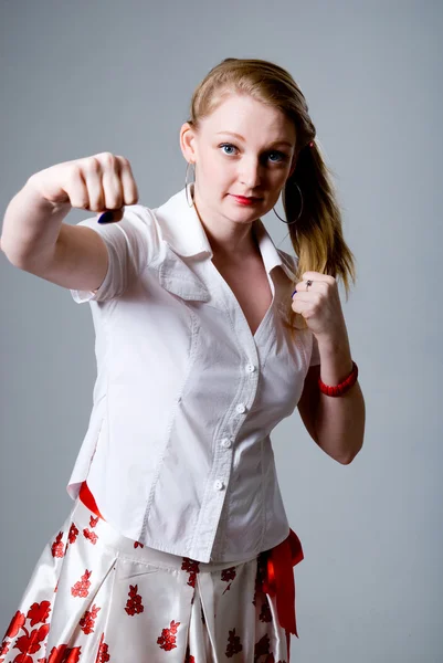 Portrait of an attractive young female punching — Stock Photo, Image