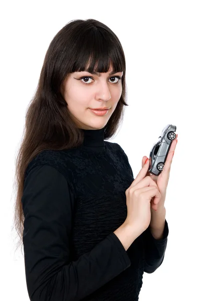 Portrait of a beautiful young woman dreaming to purchase a new c — Stock Photo, Image