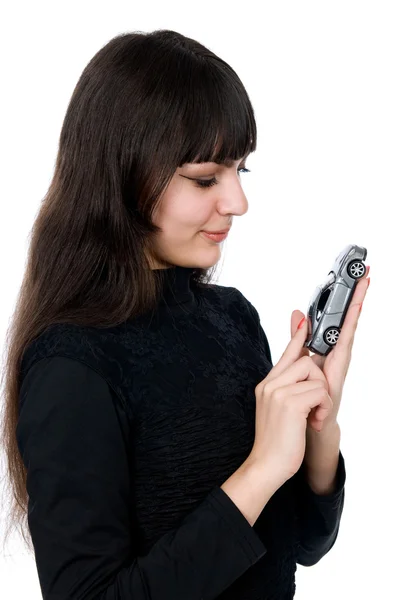 Portrait of a beautiful young woman dreaming to purchase a new c — Stock Photo, Image