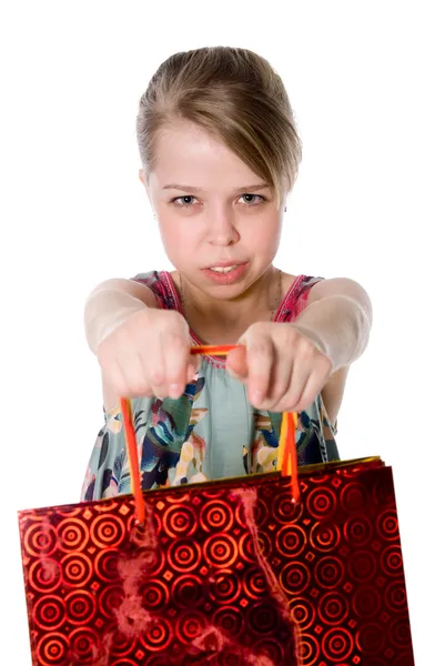 Ein Mädchen hält eine Einkaufstasche. — Stockfoto