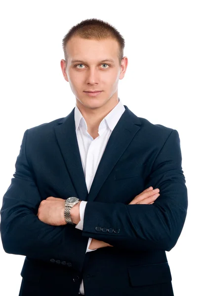 Portrait of a handsome young businessman staring against — Stock Photo, Image