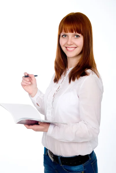 Felice studente dai capelli rossi con penna e quaderno . — Foto Stock