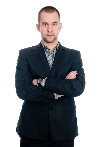 Portrait of a handsome young businessman staring against — Stock Photo, Image