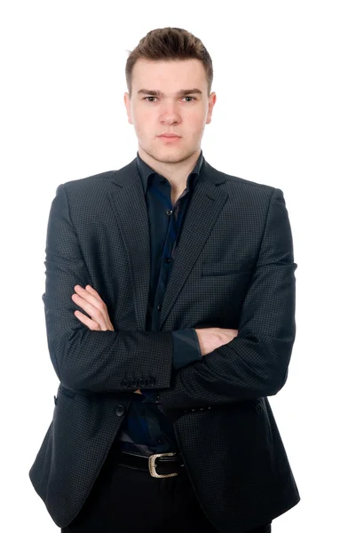 Portrait of a handsome young businessman staring against — Stock Photo, Image