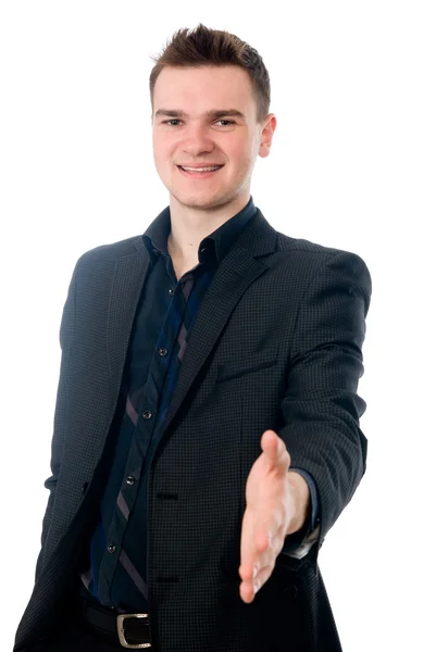 Young man in suit offering to shake the hand — Stock Photo, Image