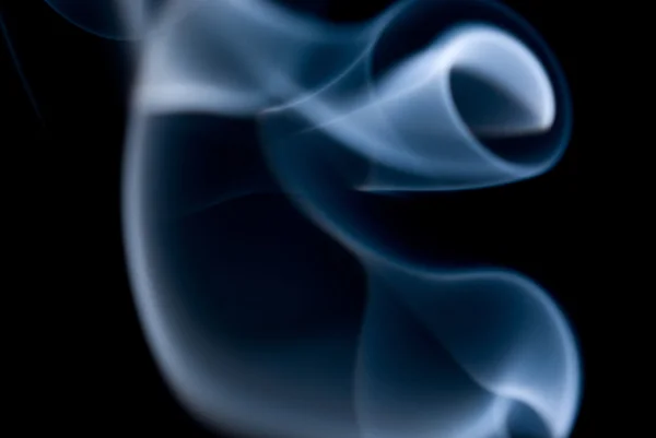 Blurred blue swirls on a black background — Stock Photo, Image