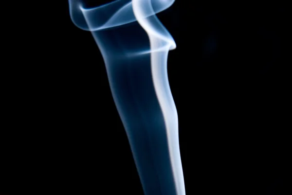 A pillar of blue smoke on a black background — Stock Photo, Image