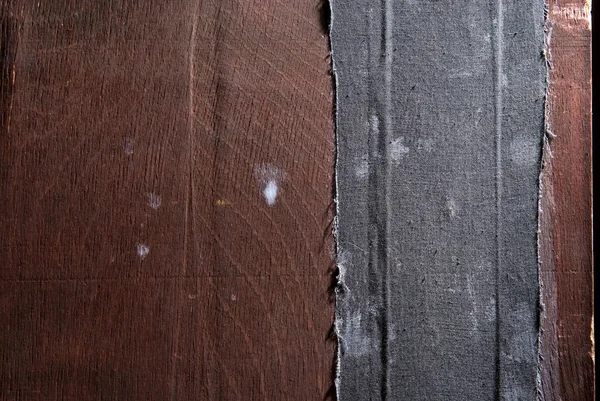 Altes Stück Holz mit schwarzem Tuch — Stockfoto