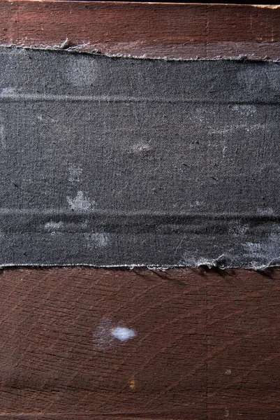 Pieza vieja de madera con paño negro — Foto de Stock
