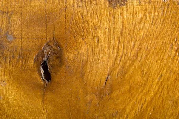 Fond en bois verni avec un trou — Photo