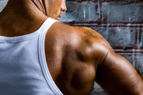 A beautiful young muscular man's shoulder — Stock Photo, Image