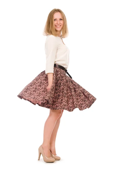 Beautiful girl with a swirling skirt — Stock Photo, Image