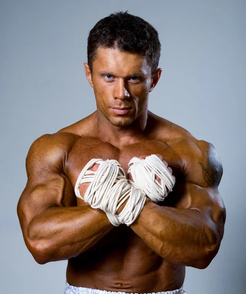 Experienced adult fighter punches during training. — Stock Photo, Image