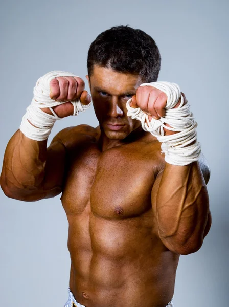 Kick-boxer in fighting stance — Stock Photo, Image