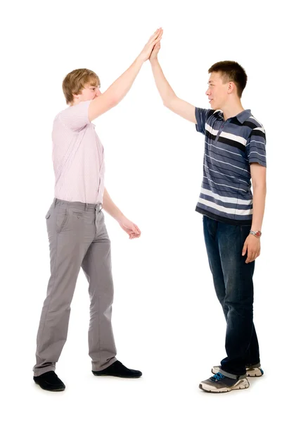 Two businessmen give each other a high five Royalty Free Stock Images