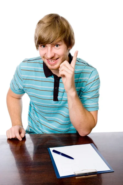 Portrait of a cheerful young man with a raised finger — Stock Photo, Image