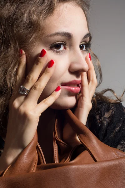 Portrait of a beautiful pensive girl with hands on face — Stock Photo, Image