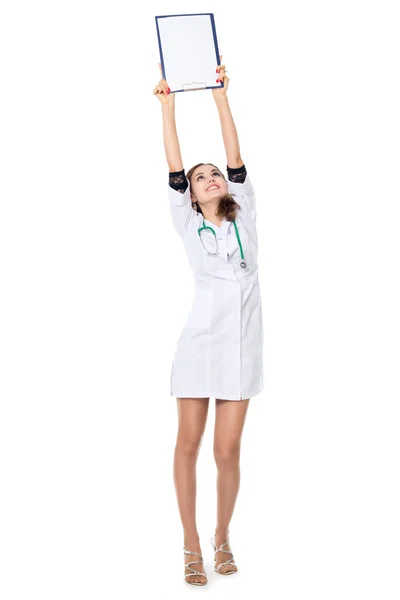 A young nurse is holding in his hand the tablet to take notes. — Stock Photo, Image