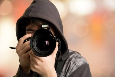 Portrait of young man photographer with camera clipart