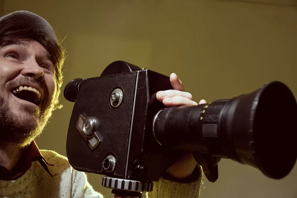 Portrait of cheerful man with a beard makes movies — Stock Photo, Image