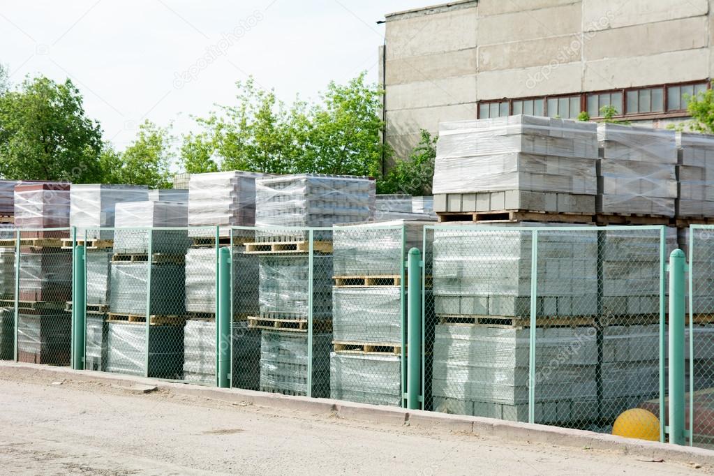 Packed cinder blocks outdoors in racks