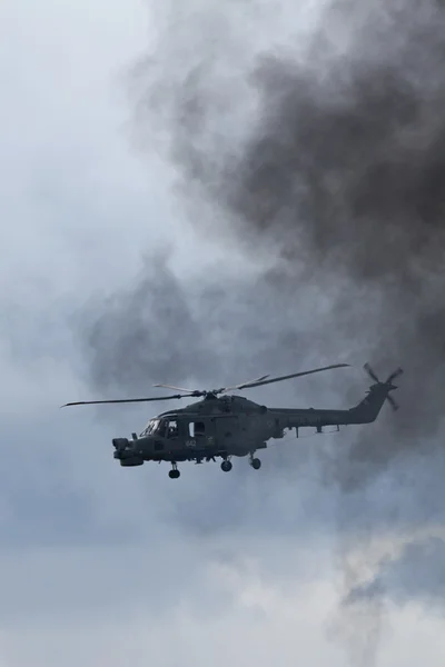 Helicopter in smoke — Stock Photo, Image