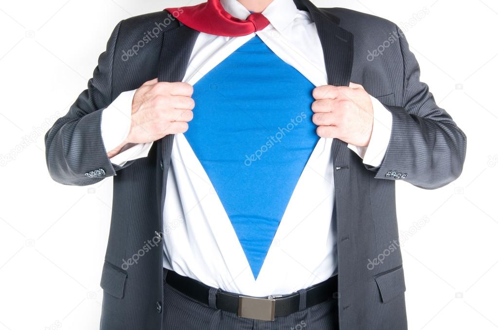 Business man tearing shirt to become a superhero